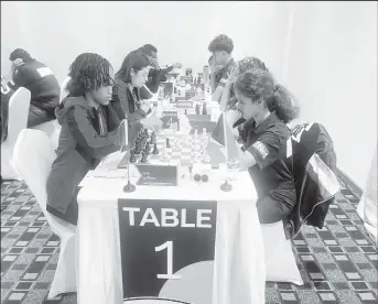  ?? ?? Guyana’s youngest player, 13-year-old Aditi Joshi (right), in action at the CARICOM Classic Chess Tournament.