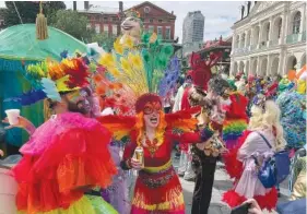 Revelers in a fanciful Barbie costumes participate in the carnival