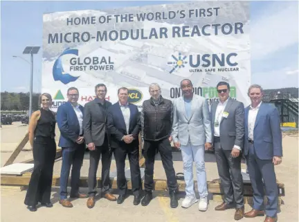  ?? ?? Michael Lee-chin (3rd right) poses with officials of the Canadian Nuclear Laboratori­es at the ground breaking for the first small modular nuclear energy plant last Thursday.