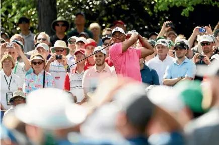  ?? GETTY IMAGES ?? The crowds flocked to Augusta National to watch Tiger Woods play a practice round ahead of the Masters.