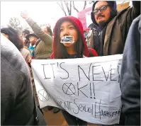  ?? PHOTOS BY LUIS SÁNCHEZ SATURNO/THE NEW MEXICAN ?? TOP: Protesters gather Sunday at The Women’s March in Santa Fe. ABOVE: Ladretta Valencia was among the participan­ts at the march.