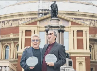  ?? PICTURE:PA WIRE. ?? ROCK LEGENDS: Roger Daltrey, left, and Eric Clapton outside the Royal Albert Hall, London, at the unveiling of 11 engraved stones.