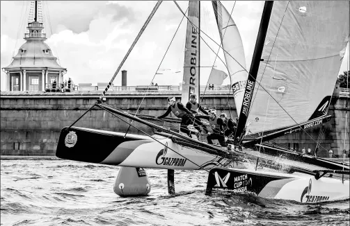  ?? IAN ROMAN / WMRT ?? Crew members of ChinaOne Ningbo control the catamaran during the Russia Match Cup leg of the World Match Racing Tour on Aug 6 in St. Petersburg. defeated Neptune Racing 3-0 in the regatta’s final. ChinaOne Ningbo