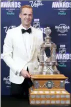  ?? JOHN LOCHER — THE ASSOCIATED PRESS ?? Pekka Rinne of the Predators poses with the Vezina Trophy after winning the award on Wednesday in Las Vegas.