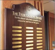  ?? Alyssa Seidman / Hearst Connecticu­t Media ?? The senior selected to wear No. 34 each season is also honored with the Tyler Ugolyn Award. A plaque with each of the player’s names can be found in the lobby outside the gymnasium at Ridgefield High.