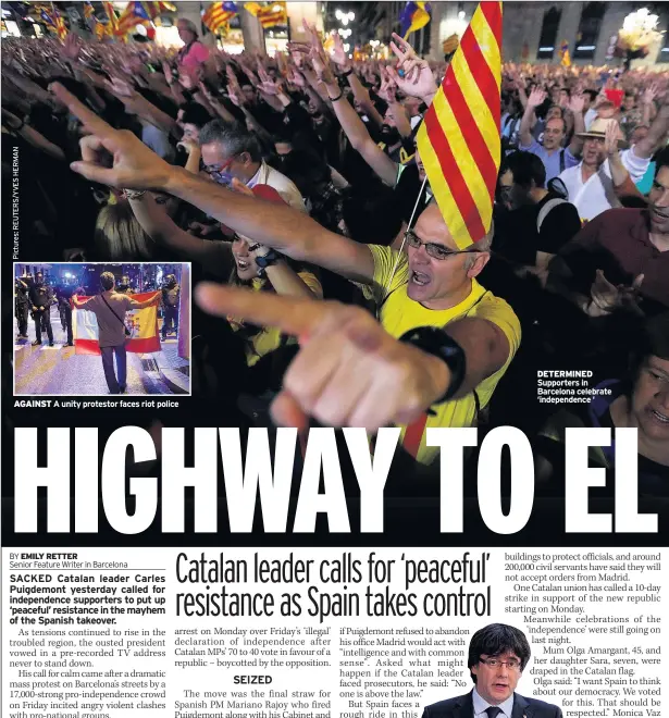  ??  ?? AGAINST A unity protestor faces riot police DETERMINED Supporters in Barcelona celebrate ‘independen­ce ‘