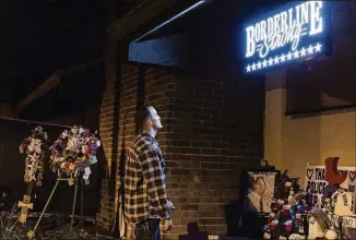  ?? EMILY BERL/THE NEW YORK TIMES PHOTOS ?? Brendan Kelly visits a memorial to victims at the Borderline Bar and Grill in Thousand Oaks, Calif. Two of his friends were killed in the November shooting.