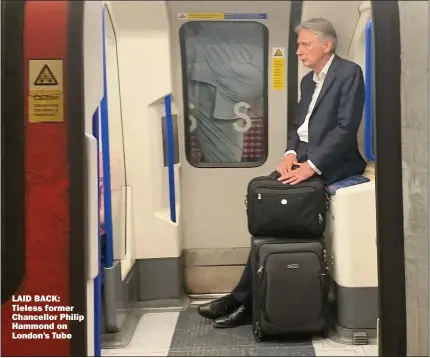  ??  ?? LAID BACK: Tieless former Chancellor Philip Hammond on London’s Tube