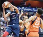  ??  ?? In this June 11, 2019 file photo, Washington Mystics forward Elena Delle Donne pulls down a rebound next to Connecticu­t Sun guard Layshia Clarendon during a WNBA basketball game in Uncasville, Connecticu­t. (AP)