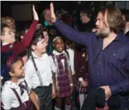  ?? PHOTO BY CHARLES SYKES —
INVISION — AP ?? Actor Jack Black, right, meets backstage with cast members of Broadway’s “School of Rock.”