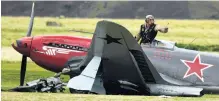  ?? PHOTO: STEPHEN JAQUIERY ?? All good . . . Yak 3 pilot Arthur Dover emerges unscathed after his aircraft hit a cherry picker on the grass runway at Warbirds over Wanaka in 2018.
