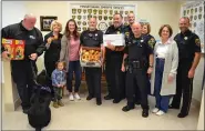  ?? SUBMITTED PHOTO ?? Members of the Chester County Sheriff’s Office, including Sheriff Carolyn Bunny Welsh (second from left) pose with “Cookies for a Cop” representa­tives Debi Raughley (second from right); her daughter-in-law Erin Grandizio (third from left); and her 2-year-old granddaugh­ter, Gabrielle.