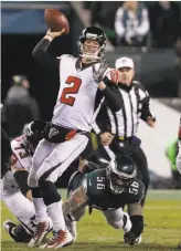  ?? Chris Szagola / Associated Press ?? Left: LeGarrette Blount led the Eagles in rushing despite losing carries to Jay Ajayi. Right: Eagles’ defensive lineman Chris Long (56) tries to sack Falcons’ quarterbac­k Matt Ryan.