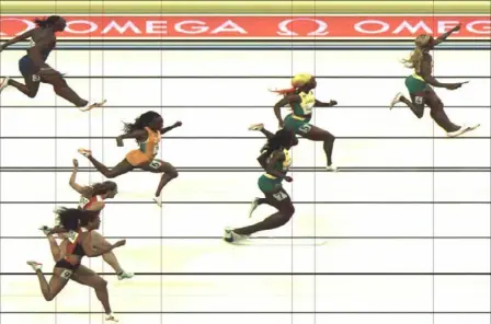  ?? Getty Images ?? A side view shows by how far Elaine Thompson-Herah won the women’s 100, even while celebratin­g at the end.