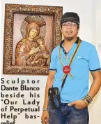  ??  ?? Scu lptor Dante Blanco beside his “Ou r Lady of Perpetual He lp” ba srelief