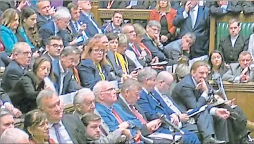  ??  ?? Boris Johnson, far right, speaks in support of his proposed Brexit deal to a packed House of Commons but did not ask them to