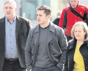  ??  ?? Paddy Jackson arrives at court with his family on Thursday and (above) co-accused Blane McIlroy