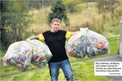  ?? ROB BROWNE ?? Rory Perkins, of Blaina, who raises money for charity by collecting and recycling crisp packets