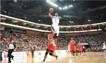  ?? Images ?? Terrence Williams of the New Jersey Nets dunks against the Houston Rockets during a 2010 game in China. Photograph: Jesse D Garrabrant/NBAE/Getty