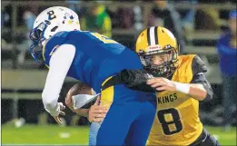  ?? VINCENT D. JOHNSON/DAILY SOUTHTOWN PHOTOS ?? St. Laurence’s BryanWalsh sacks De La Salle’s Michael Passarelli during Friday’s game.