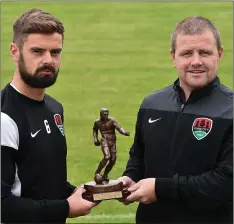  ??  ?? Greg Bolger receives his award from John Cotter, Cork City coach.