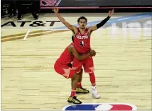  ?? DAVID BANKS ASSOCIATED PRESS ?? The Hawks’ Trae Young celebrates after making a 3-pointer during the first half of the NBA All-Star basketball game on Feb. 16 in Chicago.