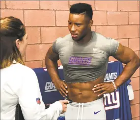  ?? Tm Canavan / Associated Press ?? New York Giants’ Saquon Barkley talks to the media after practice in East Rutherford, N.J., on Monday.