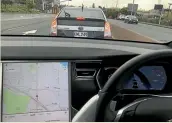  ??  ?? This is what a Prius PHV looks like from inside a Tesla. Zero100kmh in under three seconds not helping now, is it?