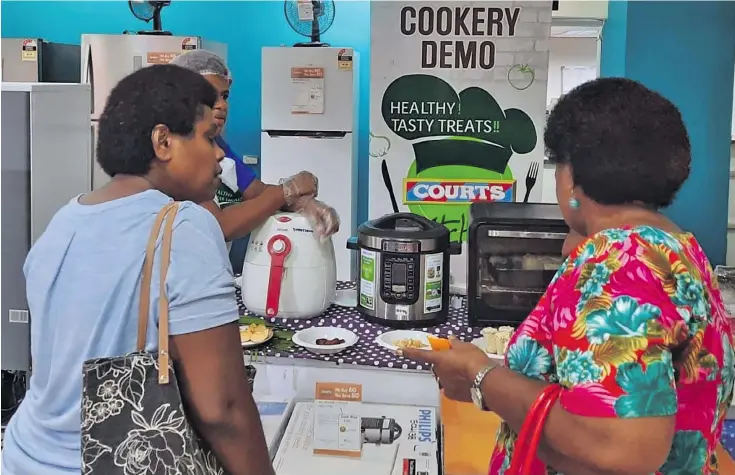  ??  ?? Customers taking advantage of deals available at Courts outlets in Suva.