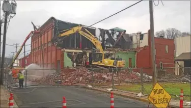 ?? SUBMITTED PHOTO ?? Hamburg resident Daren Geschwindt shares photos of a Hamburg landmark torn down in December. The Wrights Knitting Mill building had stood at Pine and Second streets for more than 100 years.