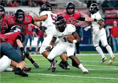  ?? Staff photo by Jerry Habraken ?? Liberty-Eylau’s Kémon Freeman scrambles through the Argyle defense during the Region II-4A, Division 1 championsh­ip game Friday night at AT&T Stadium in Arlington, Texas.