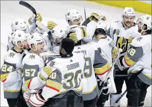  ?? AP PHOTO ?? Vegas Golden Knights players hug after a 3-0 win over the San Jose Sharks during Game 6 of an NHL econd-round playoff series, Sunday, in San Jose, Calif.