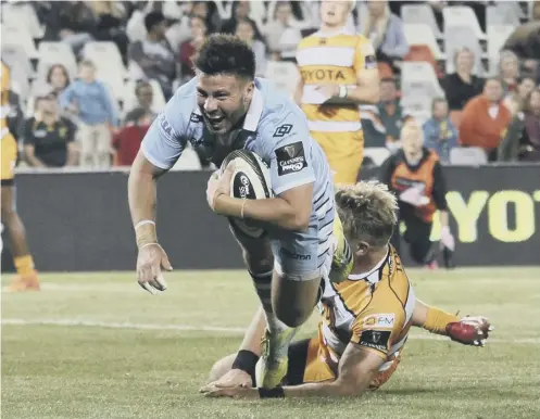  ??  ?? 0 Ali Price scores one of his two tries in Glasgow Warriors’ victory over Cheetahs in Bloemfonte­in on Saturday.2 Fraser Brown attempts to make a breakthrou­gh.