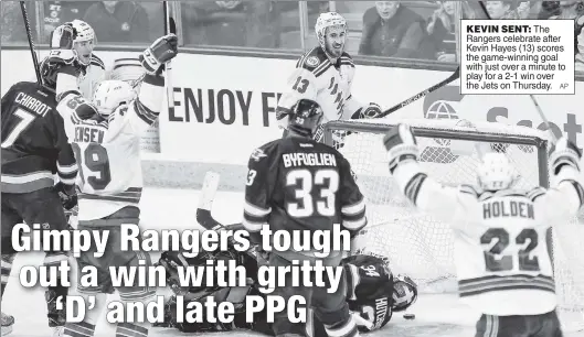  ??  ?? KEVIN SENT: The Rangers celebrate after Kevin Hayes (13) scores the game-winning goal with just over a minute to play for a 2-1 win over the Jets on Thursday.