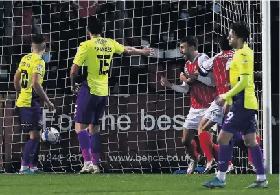  ??  ?? Andy Williams celebrates after scoring the fourth Cheltenham goal