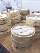  ??  ?? The making of the world’s most famous xiao long bao.