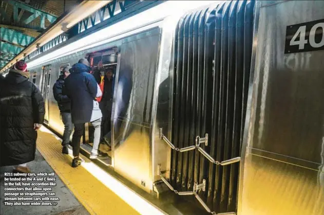  ?? AP ?? R211 subway cars, which will be tested on the A and C lines in the fall, have accordion-like connectors that allow open passage so straphange­rs can stream between cars with ease. They also have wider doors.