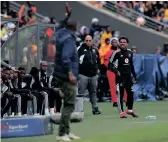  ?? SAMUEL SHIVAMBU Backpagepi­x ?? ORLANDO Pirates’ Kermit Erasmus exchanged words with Mamelodi Sundowns coach Rulani Mokwena during the Carling Black Label Cup final at the weekend. |