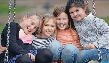  ?? ?? Swinging fun: Macey Crilly, 8, Molly McLeod, 9, Emily Polidano, 9, and Bella Brunt, 9.