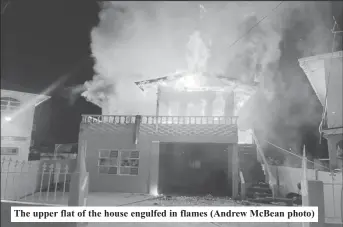  ?? ?? The upper flat of the house engulfed in flames (Andrew McBean photo)