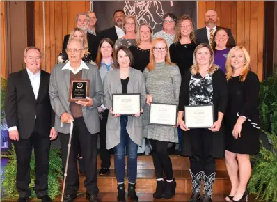  ?? GINGER ENGLISH/SPECIAL to The Saline Courier ?? 2019 Bauxite Hall of Fame inductees, from left, in the front row, are Mitch Tull, Hubert Spann, Kristy Gentry Byrd, Sharissa Oliver Ferrell, Amy Orrell Young and Corey Brown Combs; middle row, Brandi Casteel Mcdade, Wendi Kitchens Sams, Sara Raschke, Charish Schroeder Wallace and Jana Olles; back row, Paul Kimbrough, Ronnie Stuckey, Tim Bearden, Susie Simmons, Paula Davis Fitzhugh Shane Oliver.