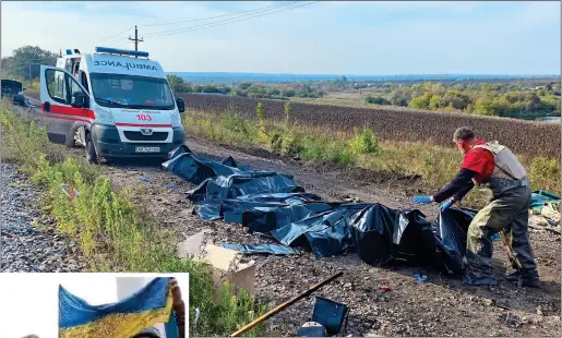  ?? ?? ATROCITY: Bodies being removed from a road in the southern Zaporizhzh­ia where Russians missiles ‘almost certainly’ hit a civilian convoy last Friday. Below: Charred vehicles at the site