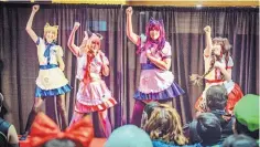  ?? COURTESY OF JOSEPH SHAUL ?? “Maids” perform a choreograp­hed dance for attendees of a Maid Cafe at a Con-Jikan Anime and Gaming Convention.