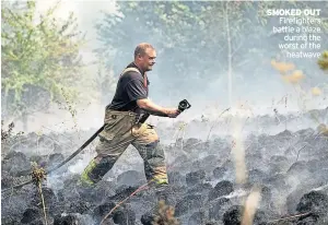  ?? ?? SMOKED OUT Firefighte­rs battle a blaze during the worst of the heatwave