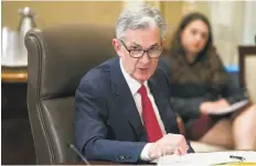  ?? Cliff Owen / Associated Press ?? Federal Reserve Board Chairman Jerome Powell chairs an open meeting in Washington last month. The Fed eventually raised rates.