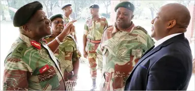  ??  ?? Major General David Sigauke stresses a point to Chronicle Editor Innocent Madonko yesterday while the Army director public relations Lieutenant Colonel Alphios Makotore (centre) listens at the commanding officers and commandant­s Press and media...