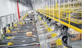  ??  ?? Amazon Orlando’s fulfillmen­t center is as large as 14 football fields