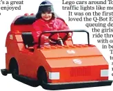  ??  ?? TOP GEAR: Claudia driving a Lego car around Toytown. Far right: Fans watch the Lego Movie 4D