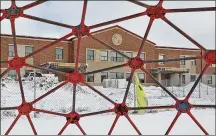  ?? BILL LACKEY / STAFF ?? The new Northeaste­rn School under constructi­on is seen through playground equipment at South Vienna Elementary.