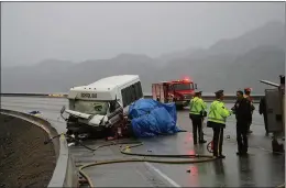  ?? Herald file photo ?? The aftermath of a 2011 school bus crash on Highway 97 near Summerland. Two victims are still fighting for compensati­on in court.